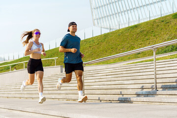 Morning Joggers Enjoying a Vibrant Run on a Sunny Day at a Modern Urban Park
