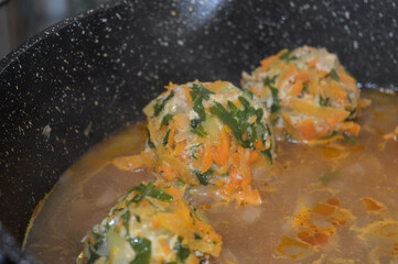 homemade vegetable patties grated carrots greens simmering in a pan steam rising adds a cozy vibe healthy home cooking food recipe vegan vegetarian lifestyle courses kitchenware meal prep clean eating