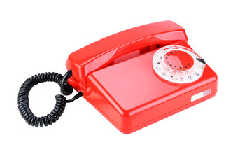 Bright red rotary phone on a white background showcasing vintage design