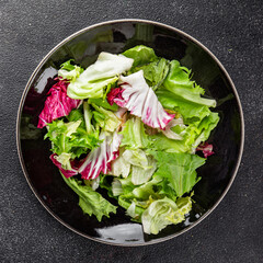 Salad mixed leaves iceberg, batavia, lettuce, radicchio, romano, frisee appetizer vegetables dish...
