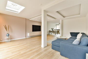 A stylish living room featuring contemporary furniture, elegant lighting, and an open layout that enhances comfort and aesthetics.