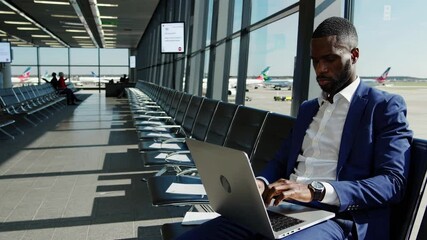 African American businessman working at airport