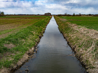 Fototapeta premium Straightened and deepened stream increasing drought risk in farmland landscape
