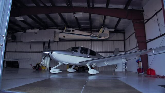 Airplane Hangar Doors Closing into Frame - Cirrus SR22 Inside - Static