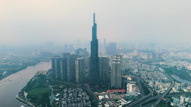 Drone shot of Landmark 81 supertall skyscraper during the day with pollution in Ho Chi Minh City, Vietnam