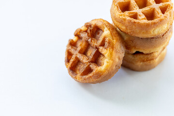 A stack of waffles with a brown topping