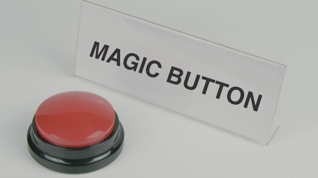 "Magic Button" text or word displayed on a nameplate as a hand presses a red button, set against a white background, symbolizing an instant solution, transformation, or a powerful action