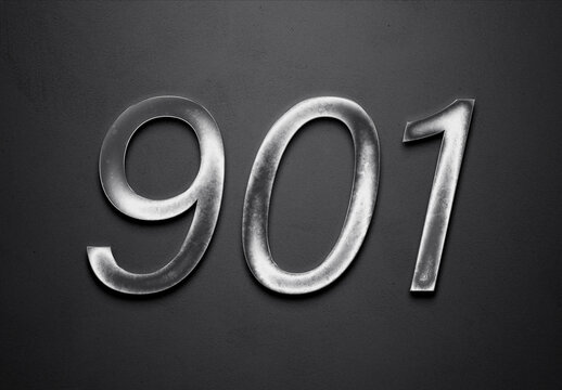 Chrome metal 3D number design of 901 on grey background.