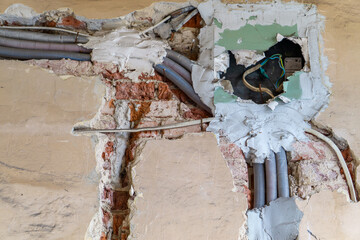 electrical installation in the wall during renovation. cables in corrugated casings, routed along...