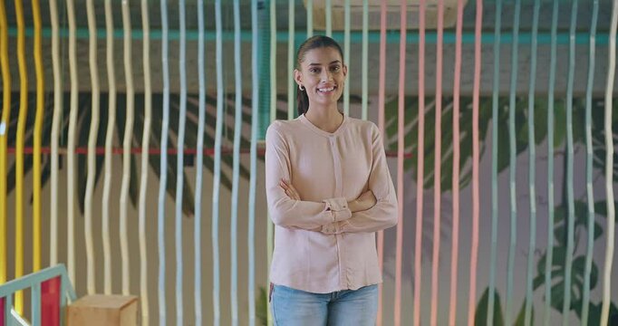Indian happy young adult gen z proud ceo women intern lady cross arms look camera indoor office place. Asian boss girl expert staff leader fold hands staring cam do casual pose at work job day time