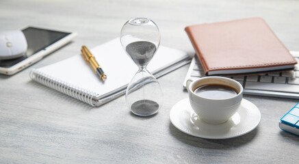 Notepad, pen, with a different business objects on the table.