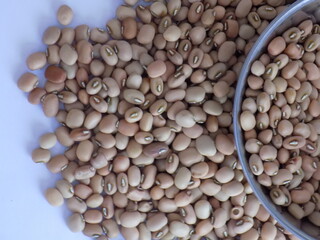 Pile and heap of a dried Red color Organic Cow Pea or Alsande Kalu in a white background.