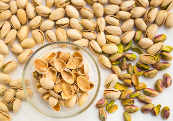 Roasted pistachios on white background