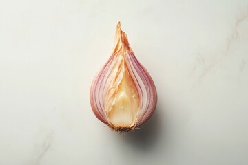Fototapeta premium A halved shallot reveals its delicate layers showcasing its vibrant pink red hues against a clean isolated on transparent background
