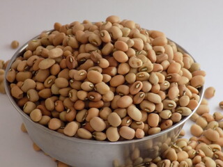 Pile and heap of a dried Red color Organic Cow Pea or Alsande Kalu in a white background.