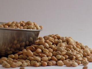 Pile and heap of a dried Red color Organic Cow Pea or Alsande Kalu in a white background.