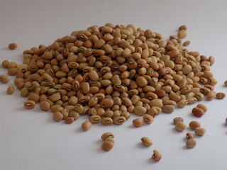Pile and heap of a dried Red color Organic Cow Pea or Alsande Kalu in a white background.