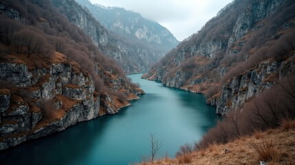 Kourtaliotiko Gorge in Greece at midday with mild, rainy winter conditions, viewed from above.