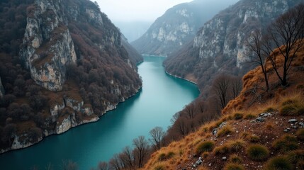 Kourtaliotiko Gorge in Greece at midday with mild, rainy winter conditions, viewed from above.