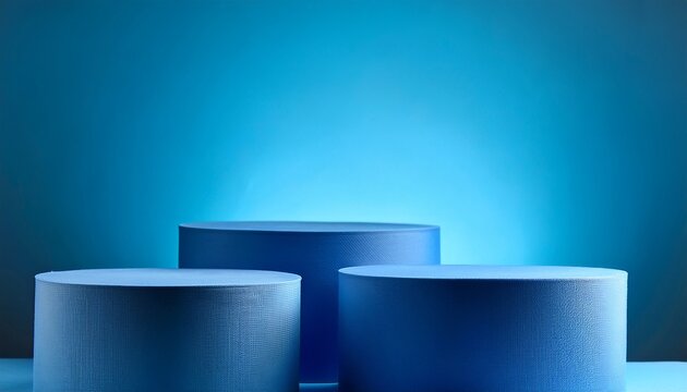 three blue cylinder podiums against matching background