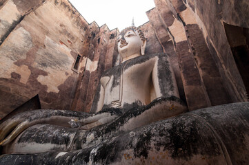 Pra Ajana buddha statues Sri​ Chum​ Temple in Sukhothai Historical Park World Heritage Site