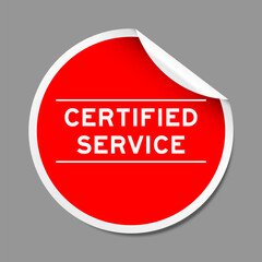 Red color peel sticker label with word certified service on gray background