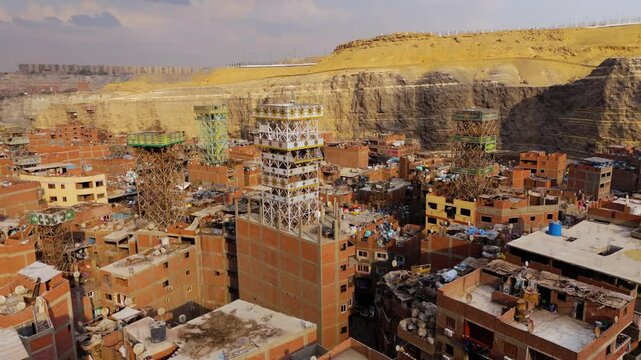 Cluttered Settlement Amidst Vast Piles Of Trash - Garbage City (Manshiyat Naser) In Cairo, Egypt. aerial shot
