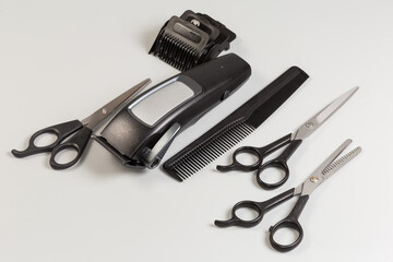 Electric hair clipper with nozzles, different hairdressers scissors and comb