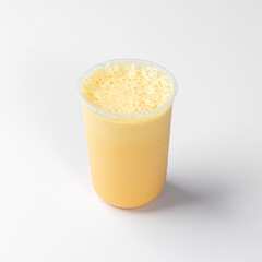 Refreshing Orange Smoothie in a Plastic Cup