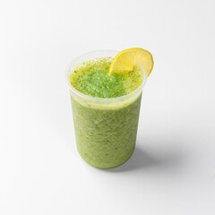 Refreshing Green Smoothie with Lemon Slice and Spinach Leaf