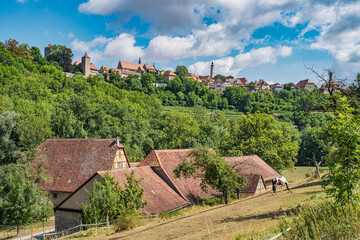 View of the romantic skyline of Rothenburg ob der Tauber at a hike through the idyllic Tauber Valley