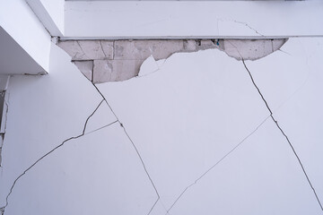 Cracks in the wall of a building damaged by the earthquake