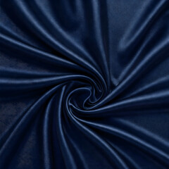 Fototapeta premium Velvet texture: Swirling abstract pattern of soft, deep blue velvet, radiating elegance and luxury. Perfect for design.