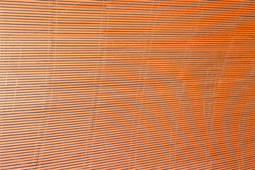 Abstract background texture of horizontal wooden slat wall panels.