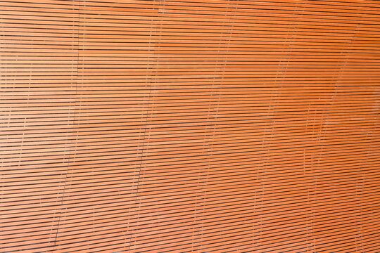 Abstract background texture of horizontal wooden slat wall panels.