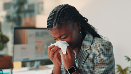 Sick, black woman and blowing nose with tissue at office for flu, cold or illness at night. Female...