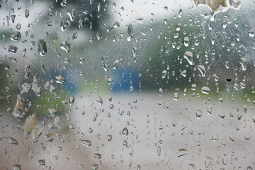 water droplets on window glass. Close up of rain on glass surface