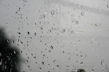 water droplets on window glass. Close up of rain on glass surface