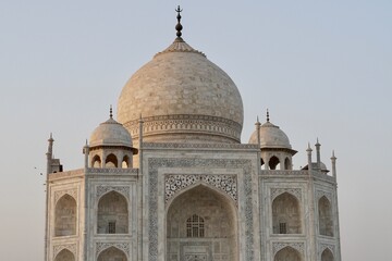 Taj Mahal at sunset. View of Taj Mahal against blue sky background.