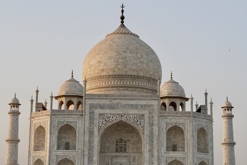 Taj Mahal at sunset. View of Taj Mahal against blue sky background.