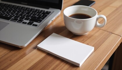 Desk Setup with Laptop, Coffee, and Notepad on Wooden Surface  