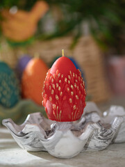 Traditional Maslenitsa: an egg-shaped candle with a willow twig. Selective focus