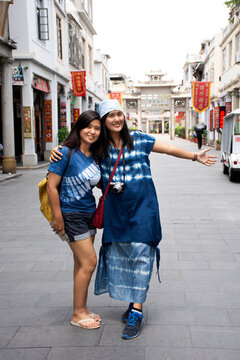 Chinese people and travelers thai women walk travel visit and take photo on Paifang Street in old ancient town at Chaozhou or Teochew city in Guangdong, China