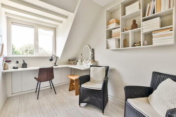 A bright and airy home office featuring a minimalist desk, stylish chairs, and organized shelves, perfect for productivity and comfort.