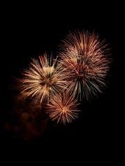 Obraz premium Vibrant fireworks explode against a deep indigo night sky, illuminating clouds with streaks of gold and crimson - background design pattern