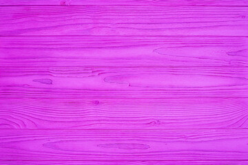 Violet painted wooden planks with visible wood grain and texture. Horizontal seamless background. Dyed timber panel surface.