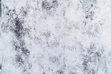 Abstract texture of a weathered white surface with scratches and smudges. ideal for backgrounds in design projects or artistic compositions