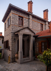 Fototapeta premium Streets and houses of traditional architecture in the mountain tourist village of Metsovo in the mountains of Epirus in Greece 