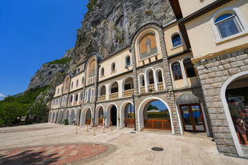 Fototapeta premium Lower Ostrog Monastery of the Serbian Orthodox Church, the most popular pilgrimage place in Montenegro - Monk residences and dorm rooms for pilgrims