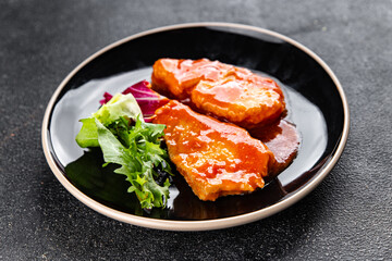 Fish tomato sauce whitefish fillet appetizer dish organic fresh tasty gourmet food background on the table rustic food top view copy space keto paleo diet vegetarian food pescetarian diet